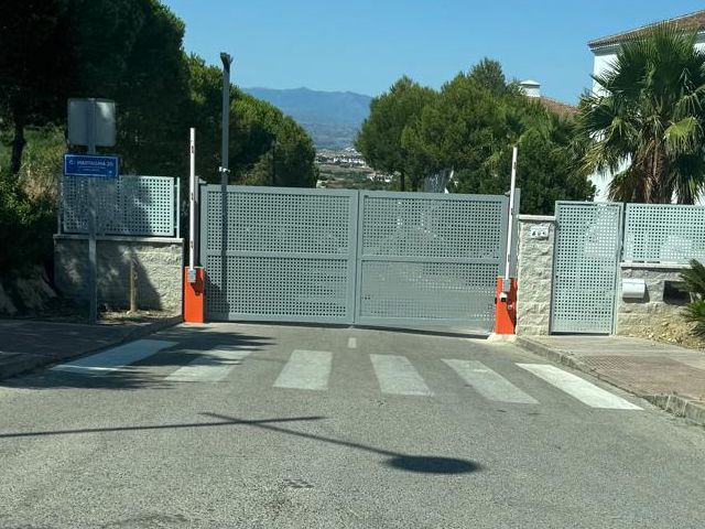 Metal gate blocking road access.